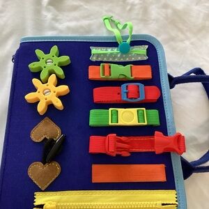 Interactive Learning Toy with Buckles and Zippers